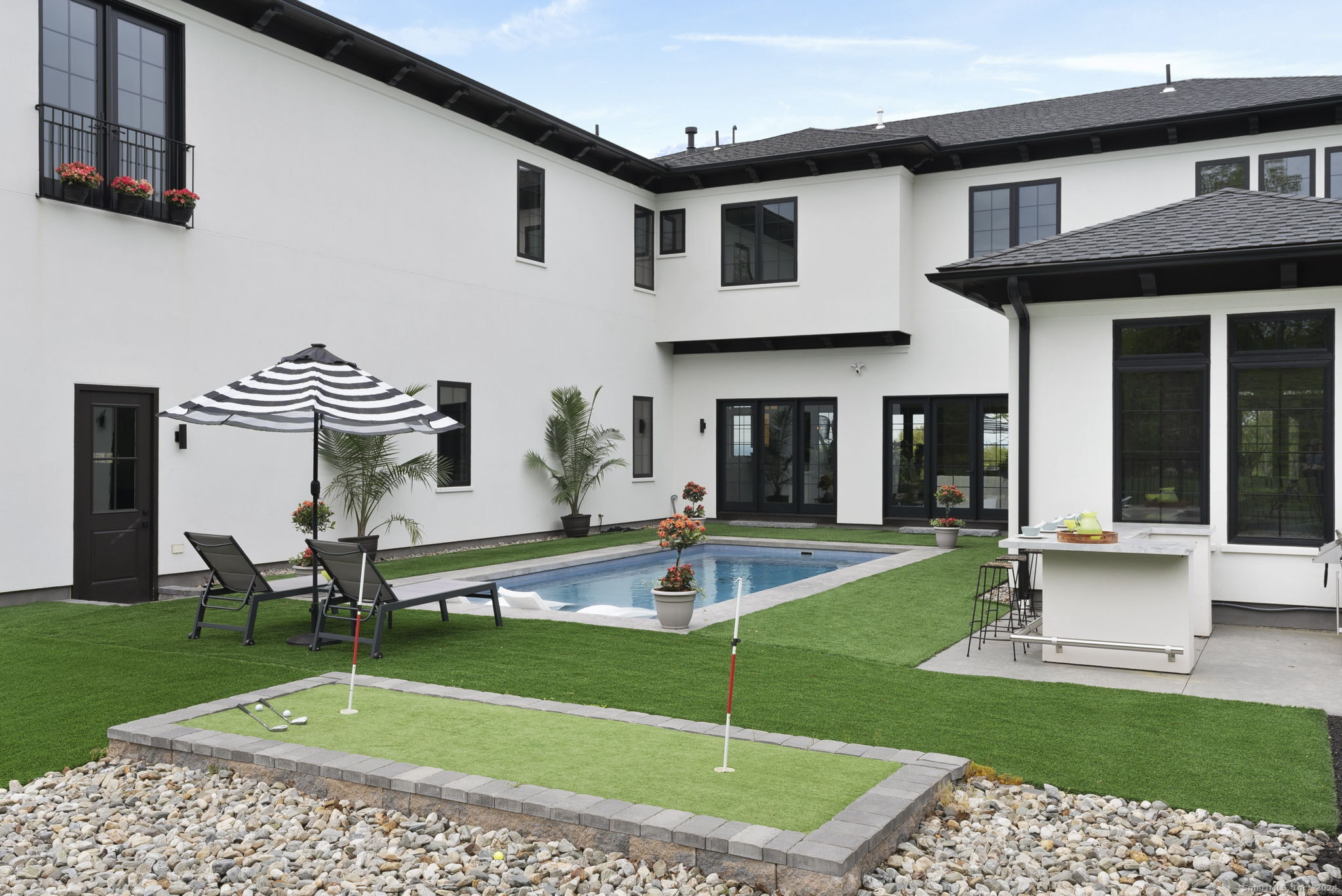 509 Cedar Ridge Drive Glastonbury, CT 06033 - Photo 20 of 40 a view of a house with a swimming pool and a yard