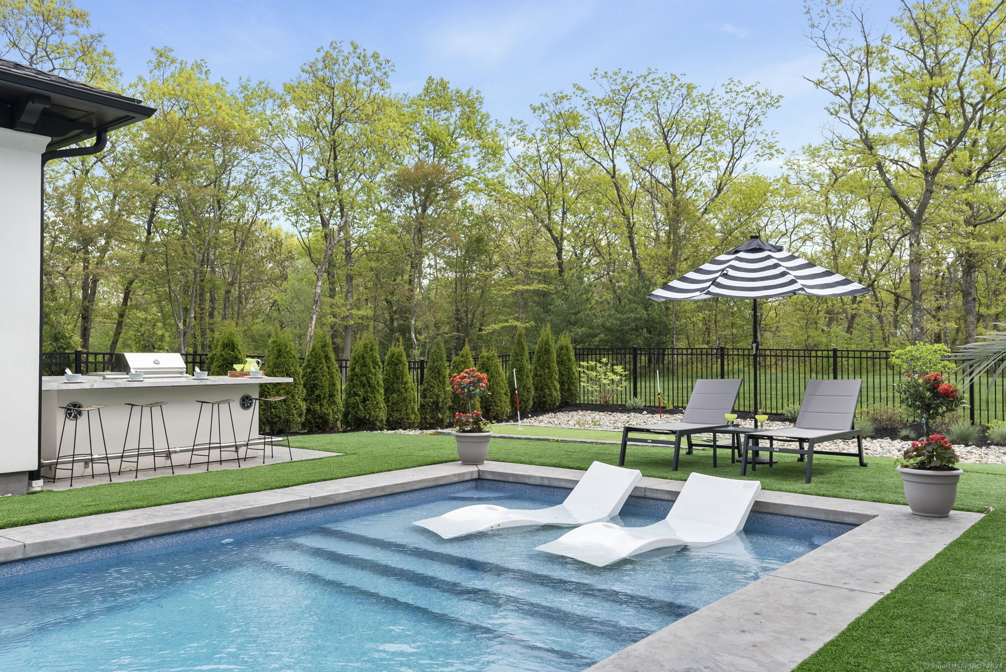 509 Cedar Ridge Drive Glastonbury, CT 06033 - Photo 21 of 40 a view of a bench in a backyard
