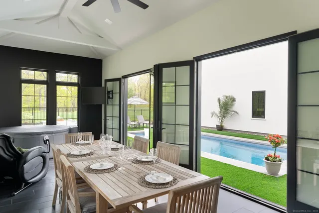 a view of swimming pool from a bathroom