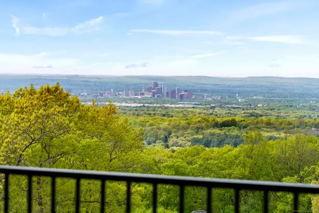 a bedroom with a bed and a fireplace