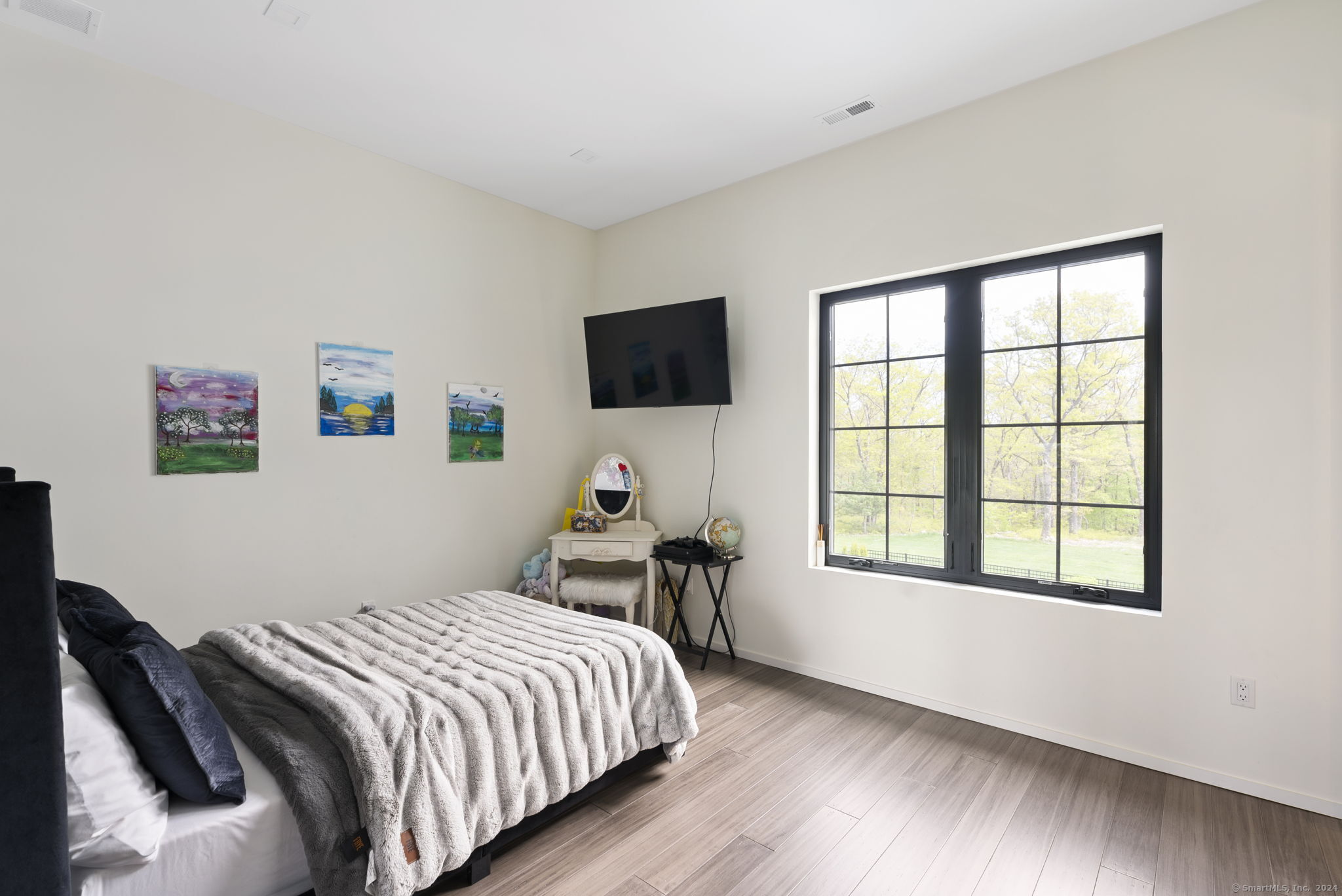 509 Cedar Ridge Drive Glastonbury, CT 06033 - Photo 38 of 40 a bedroom with a bed and a flat screen tv