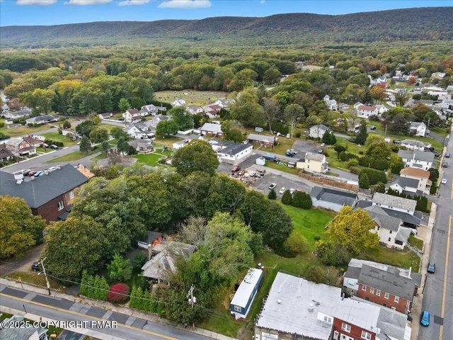an aerial view of a city with lots of residential buildings