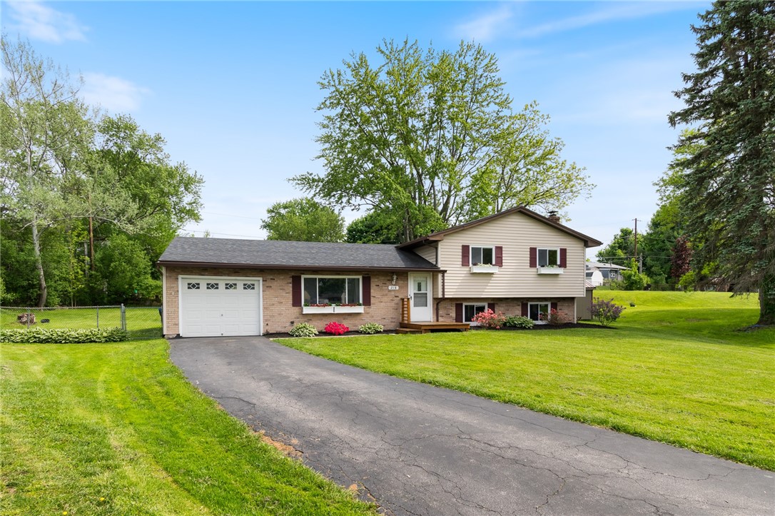 218 Kusak Road Henrietta, NY 14467 - Photo 1 of 33 Front of house with beautiful landscaping and flow