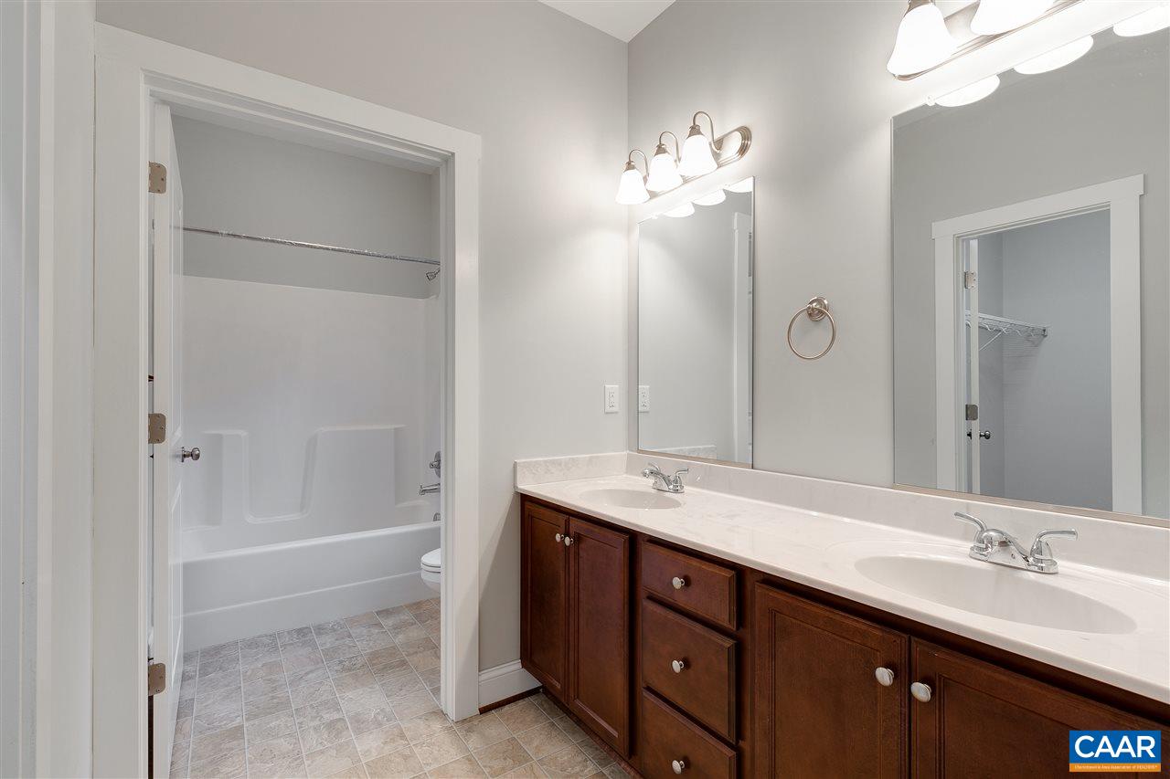 374 Winding Ridge Way Bumpass, VA 23024 - Photo 11 of 24 a spacious bathroom with a double vanity sink mirror and shower