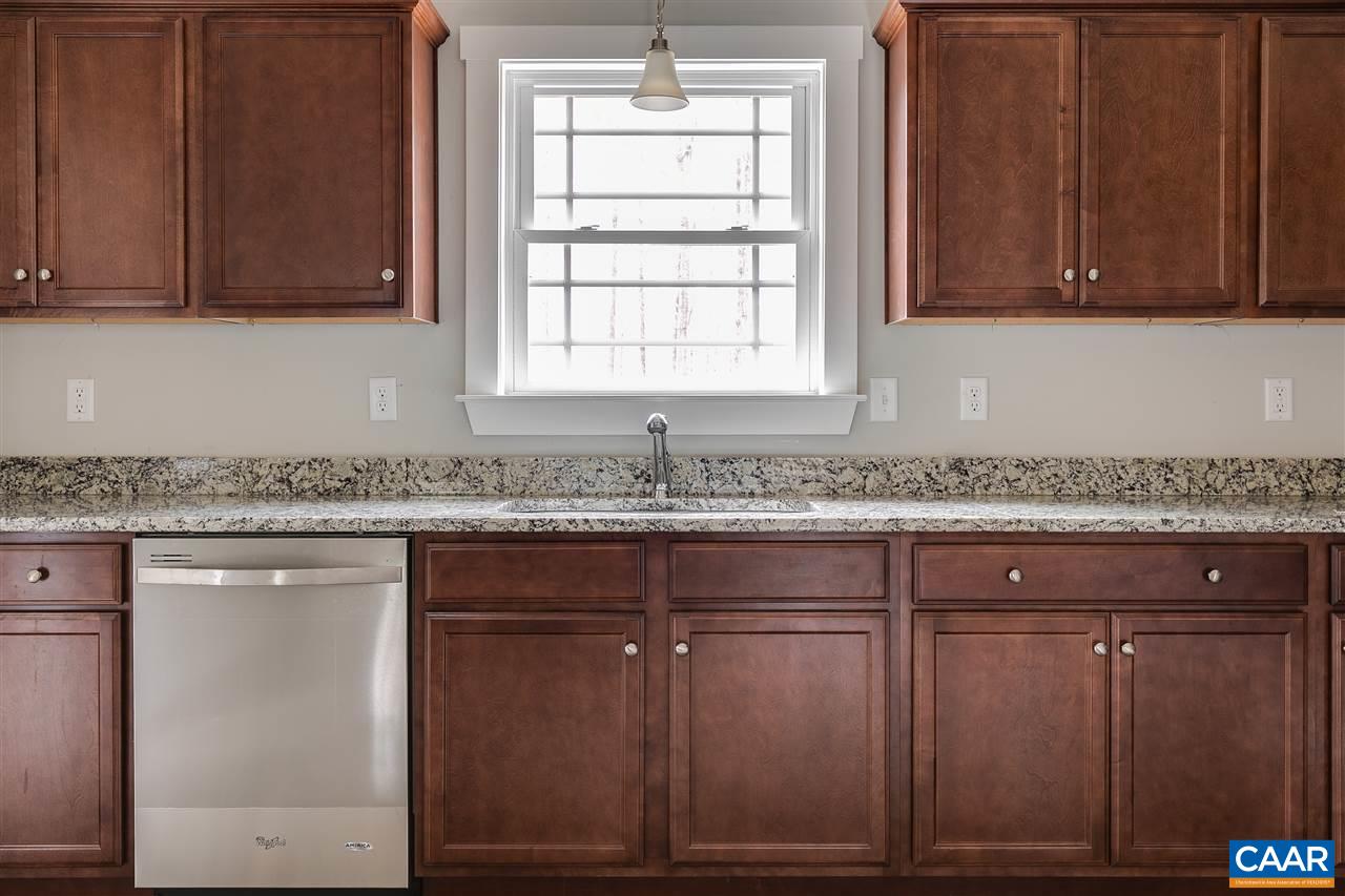 374 Winding Ridge Way Bumpass, VA 23024 - Photo 7 of 24 a sink with granite countertop cabinets and window