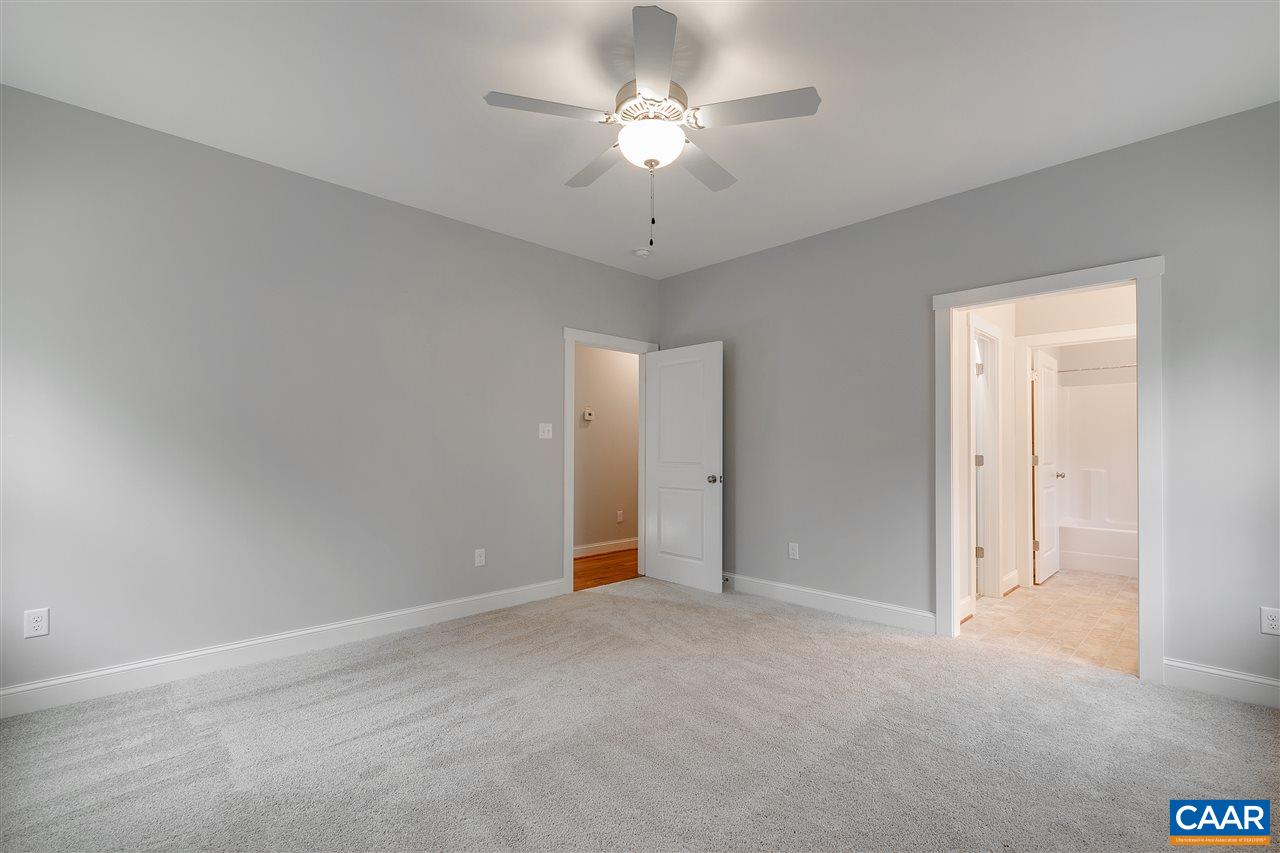 374 Winding Ridge Way Bumpass, VA 23024 - Photo 9 of 24 a view of an empty room and chandelier fan
