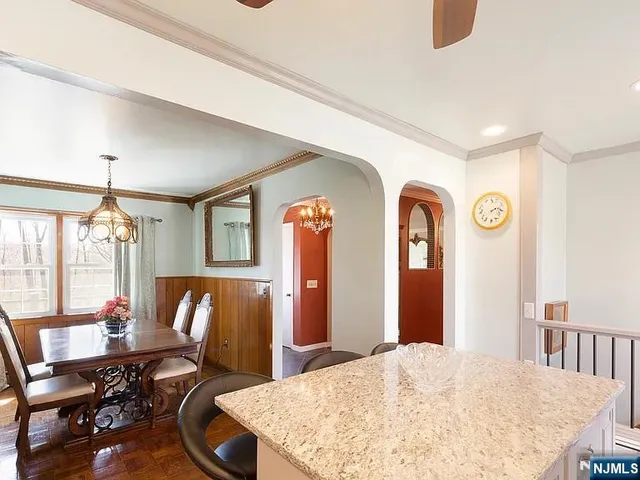 a view of a dining room with furniture and window