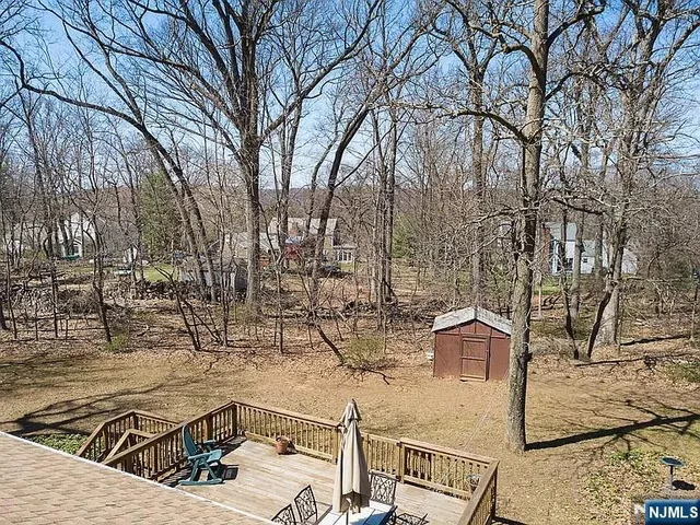 a view of a house with snow on the road