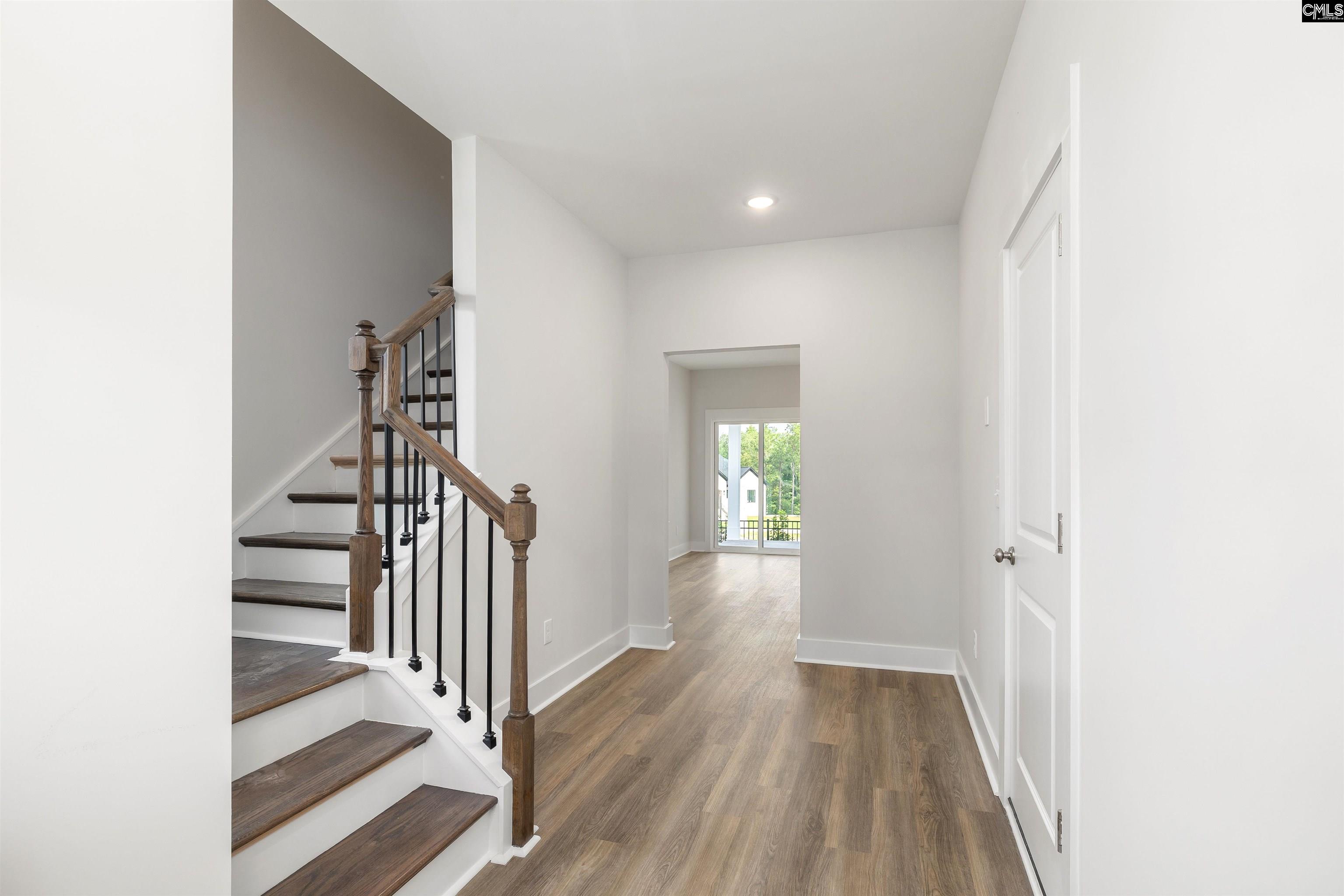 32 Fawn Spot Court Elgin, SC 29045 - Photo 4 of 28 a view of a hallway with wooden floor and entryway