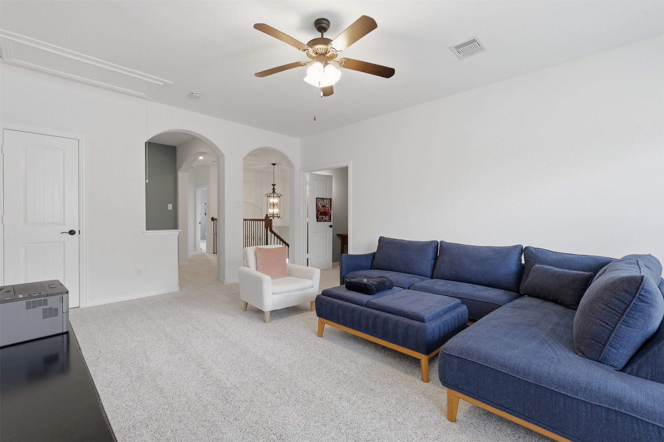 6835 Preston Grove Drive Spring, TX 77389 - Photo 34 of 49 a living room with furniture and a chandelier