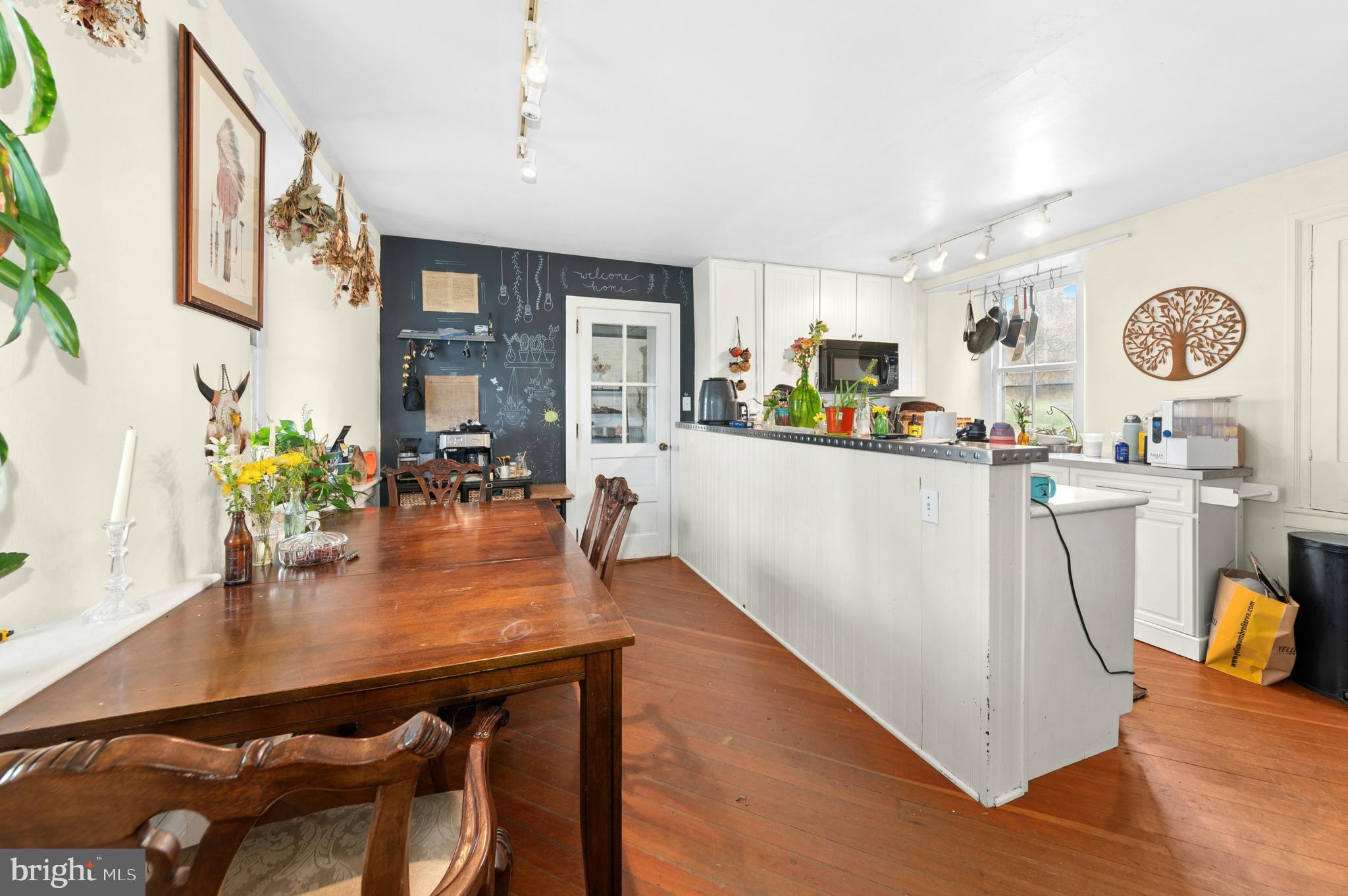 4196 Toll Gate Road New Hope, PA 18938 - Photo 11 of 19 a kitchen with a table chairs and a dining table