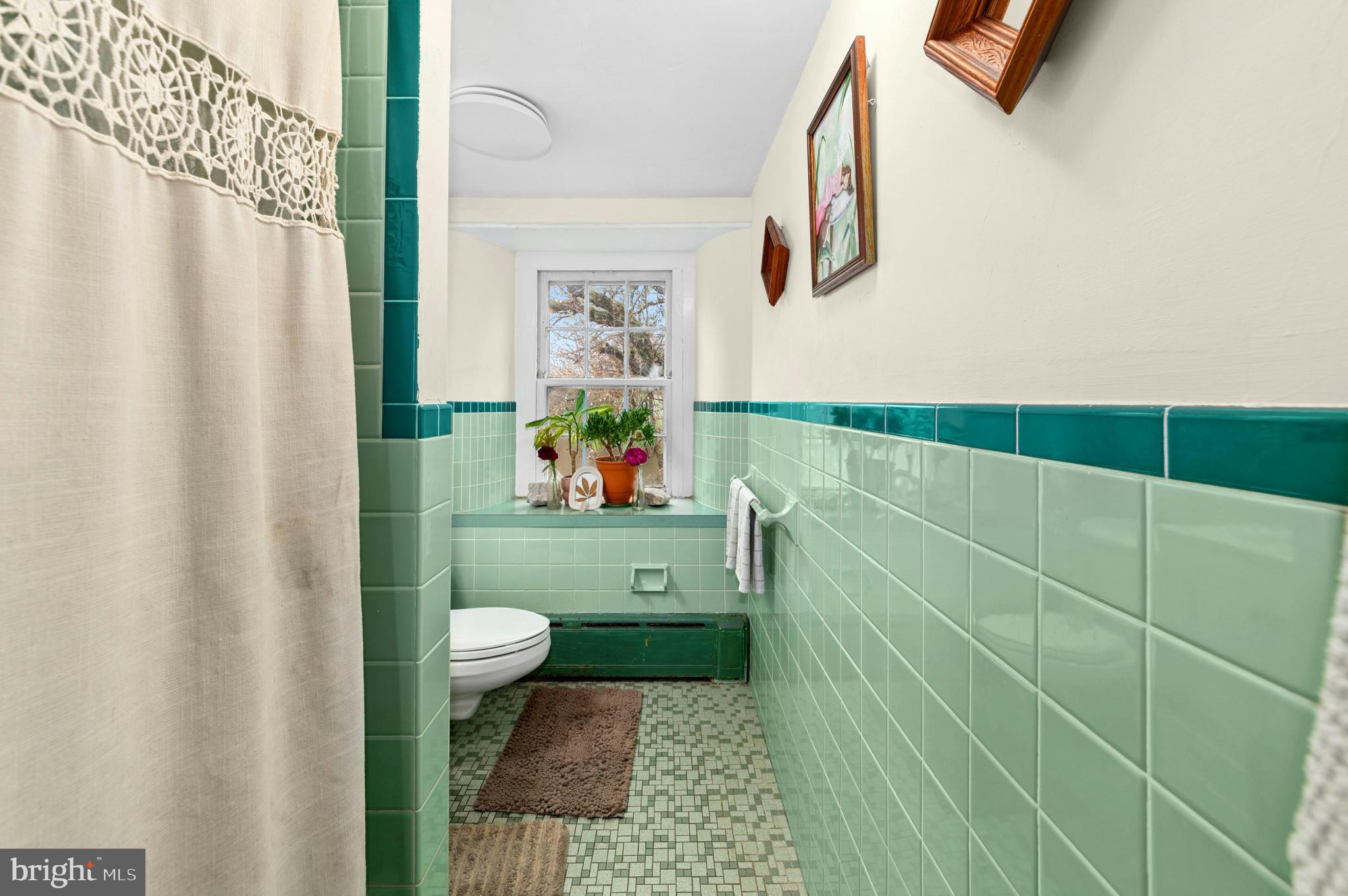 4196 Toll Gate Road New Hope, PA 18938 - Photo 16 of 19 a bathroom with a sink toilet and window
