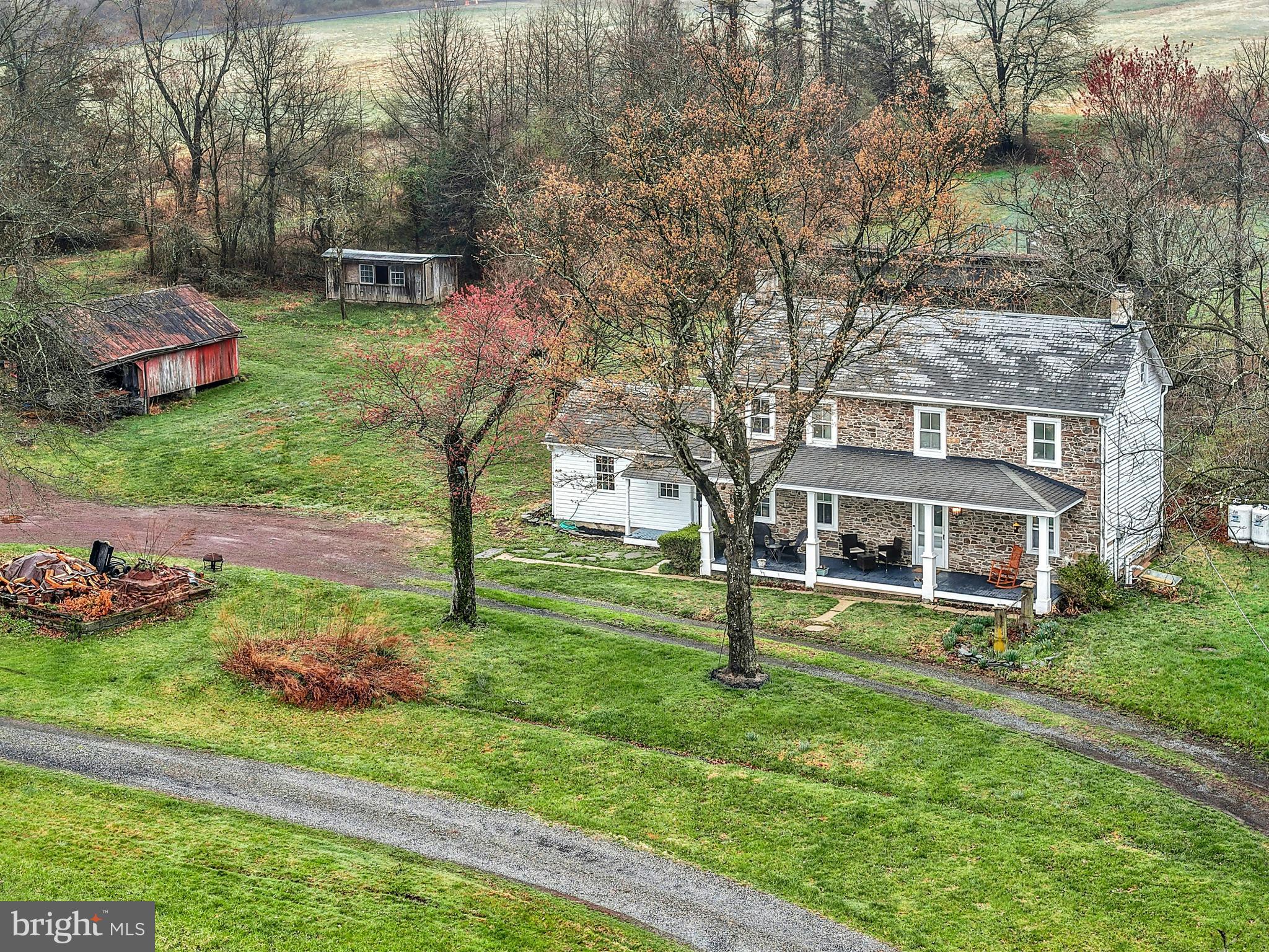 4196 Toll Gate Road New Hope, PA 18938 - Photo 3 of 19 a front view of a house with a garden and trees