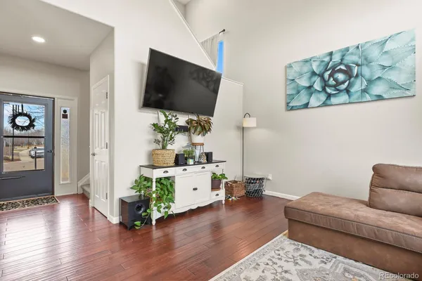 a living room with furniture and a flat screen tv