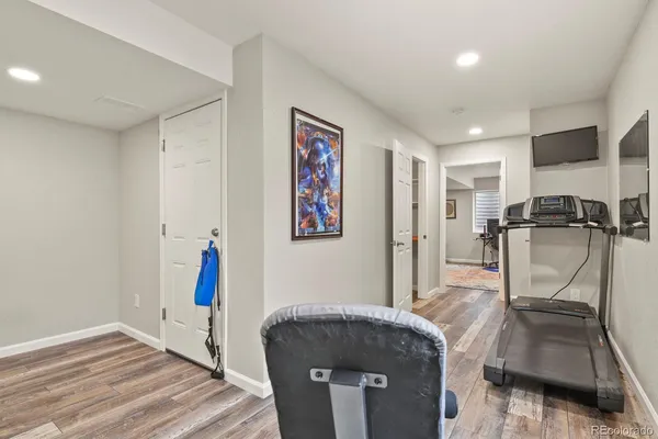 a room with gym equipment and a large window