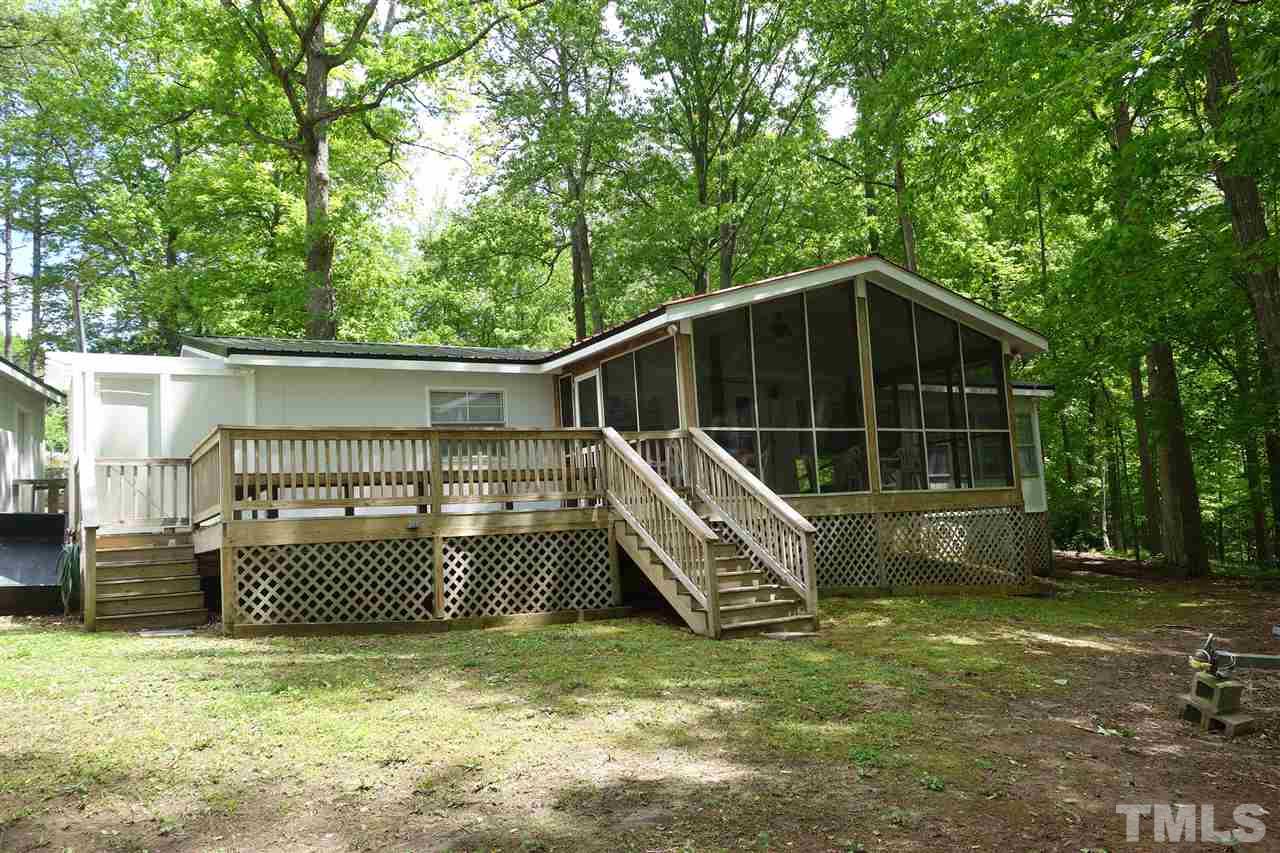 285 Kerr Lake Road Henderson, NC 27537 - Photo 2 of 25 a view of a house with a yard
