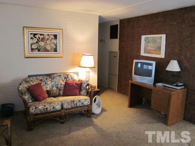 285 Kerr Lake Road Henderson, NC 27537 - Photo 13 of 25 a living room with furniture and a window