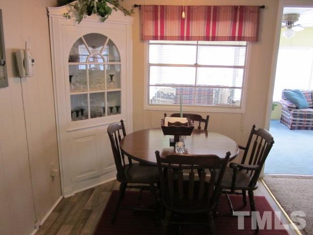 285 Kerr Lake Road Henderson, NC 27537 - Photo 14 of 25 a view of a dining room with furniture and window