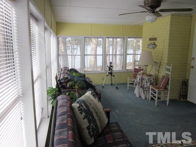 285 Kerr Lake Road Henderson, NC 27537 - Photo 16 of 25 a living room with furniture and a large window