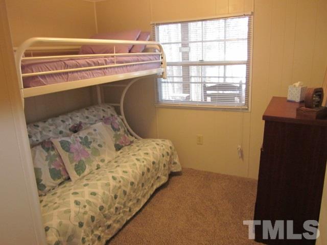 285 Kerr Lake Road Henderson, NC 27537 - Photo 20 of 25 a bedroom with a bed and a window