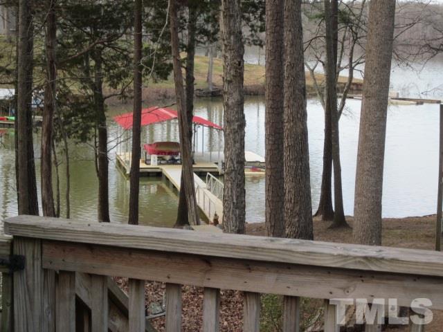 285 Kerr Lake Road Henderson, NC 27537 - Photo 8 of 25 a view of a house with a windows and a tree