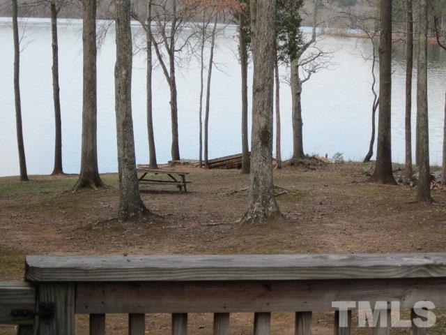 285 Kerr Lake Road Henderson, NC 27537 - Photo 9 of 25 a view of a kitchen with kitchen island and a trees