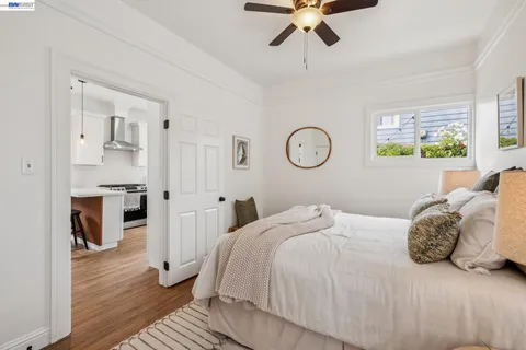 a bedroom with a bed and a lamp