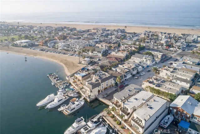 an aerial view of a city with ocean view