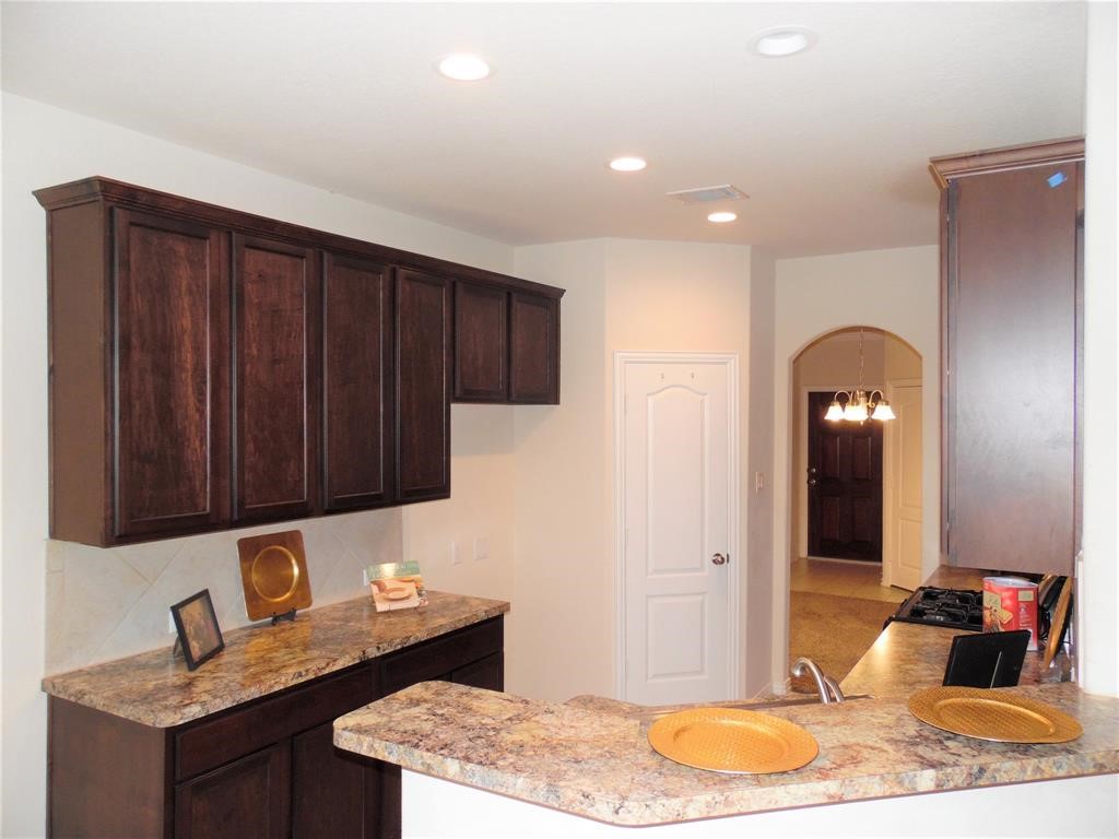 5106 Gable Lane Houston, TX 77066 - Photo 12 of 39 a bathroom with a granite countertop sink and a mirror