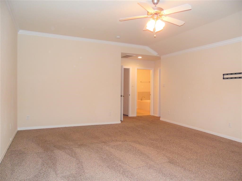 5106 Gable Lane Houston, TX 77066 - Photo 16 of 39 an empty room with a ceiling fan and a window