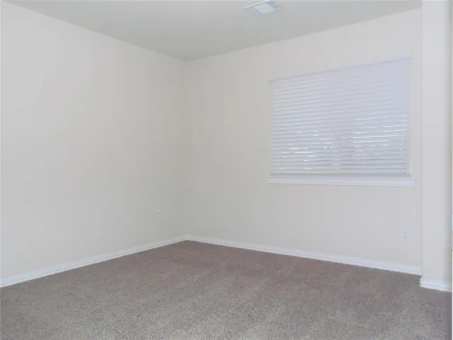 a view of an empty room and closet