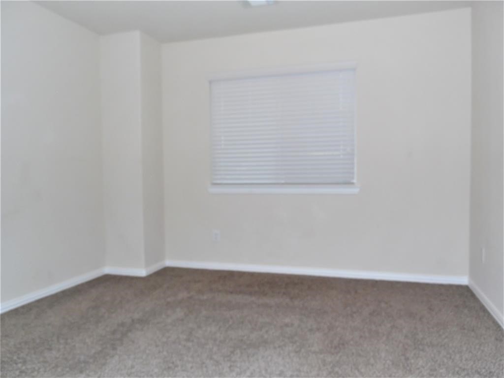 5106 Gable Lane Houston, TX 77066 - Photo 31 of 39 a view of an empty room with a window