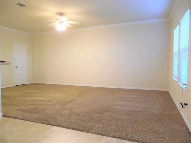 a view of an empty room and window