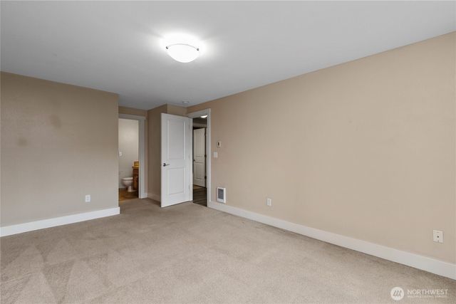 a view of an empty room and a window