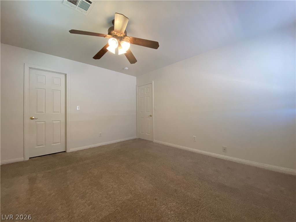 2023 Peacemaker Road Las Vegas, NV 89183 - Photo 14 of 24 Plush carpeting and classic six-panel doors define this versatile interior space.