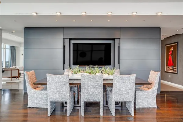 a view of a dining room with furniture and wooden floor