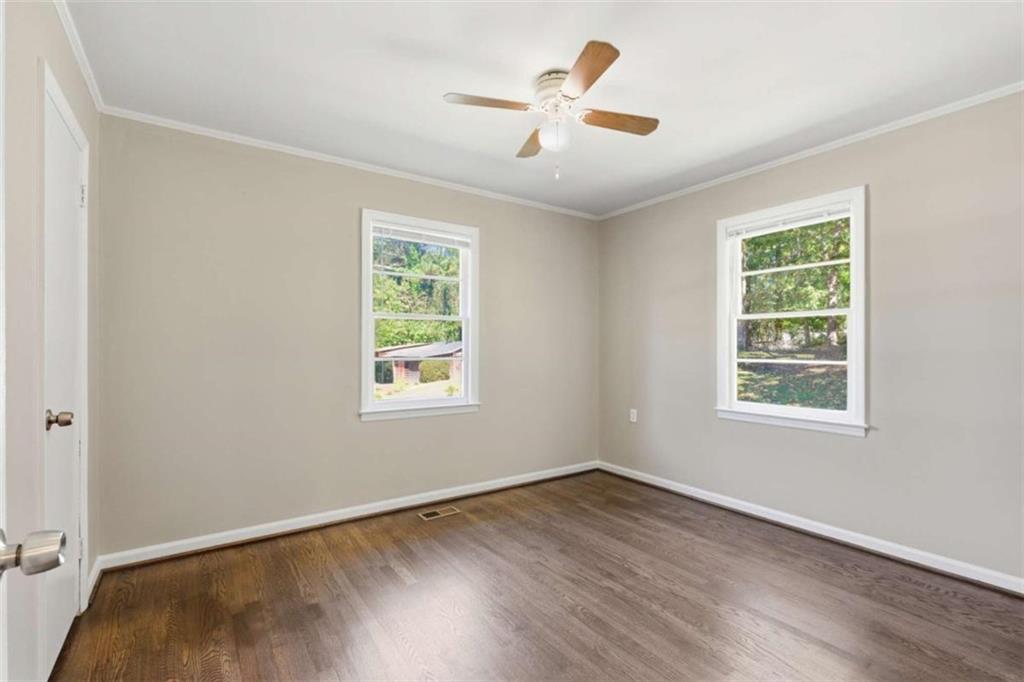 229 Hilltop Lane Toccoa, GA 30577 - Photo 13 of 30 wooden floor in an empty room with a window