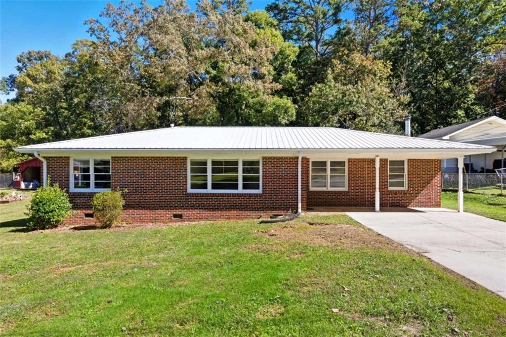 229 Hilltop Lane Toccoa, GA 30577 - Photo 24 of 30 a front view of house with yard and green space