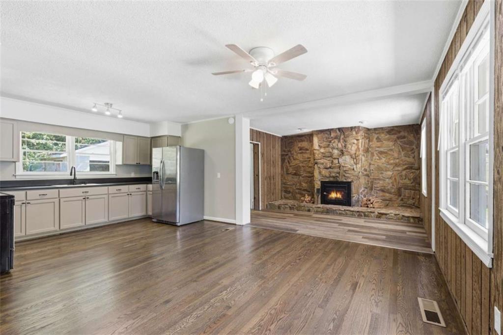 229 Hilltop Lane Toccoa, GA 30577 - Photo 4 of 30 a kitchen with a refrigerator and a stove top oven