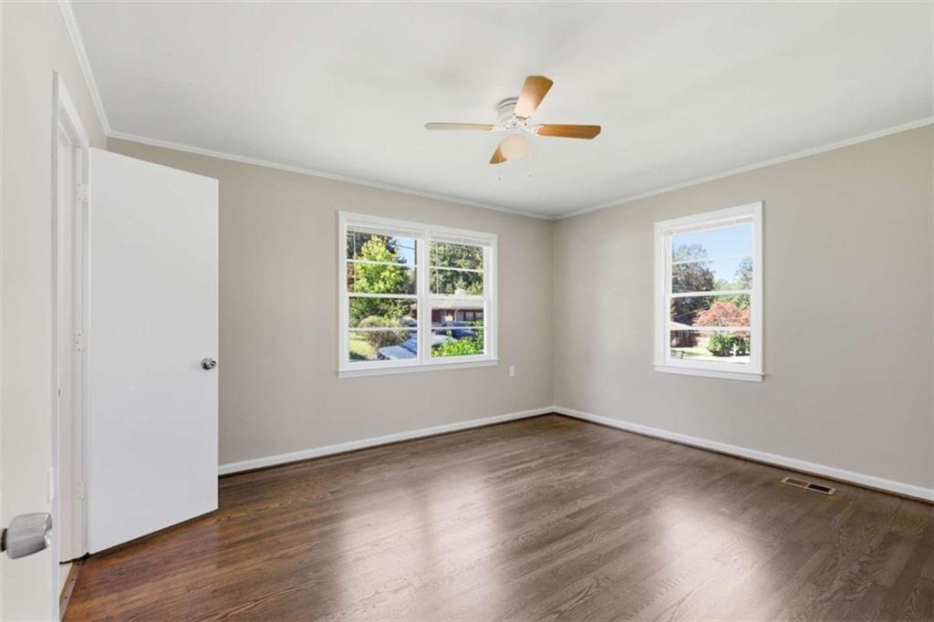 229 Hilltop Lane Toccoa, GA 30577 - Photo 10 of 30 a view of an empty room with wooden floor and a window