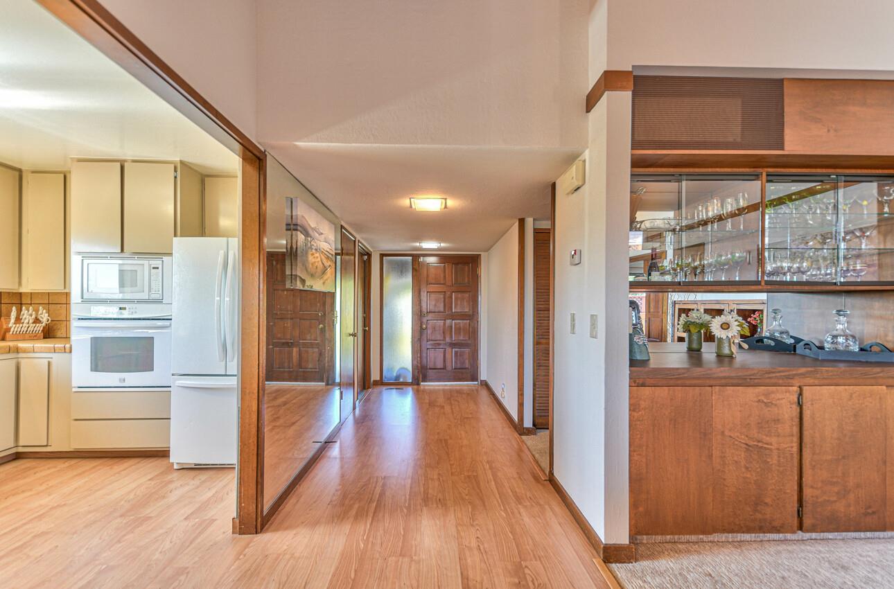 14036 Reservation Road Salinas, CA 93908 - Photo 12 of 50 a view of a hallway with wooden floor and cabinet