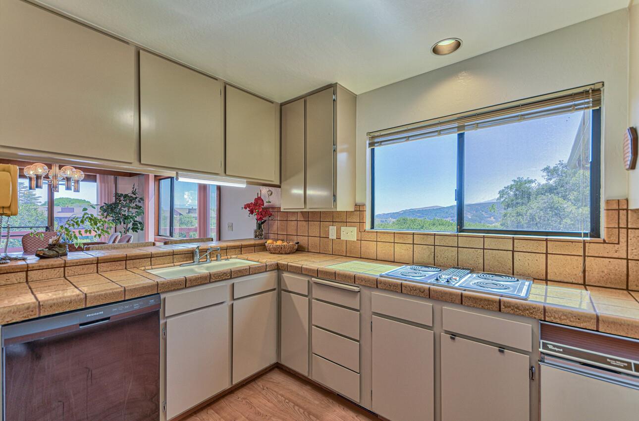 14036 Reservation Road Salinas, CA 93908 - Photo 29 of 50 a kitchen with a sink window and cabinets