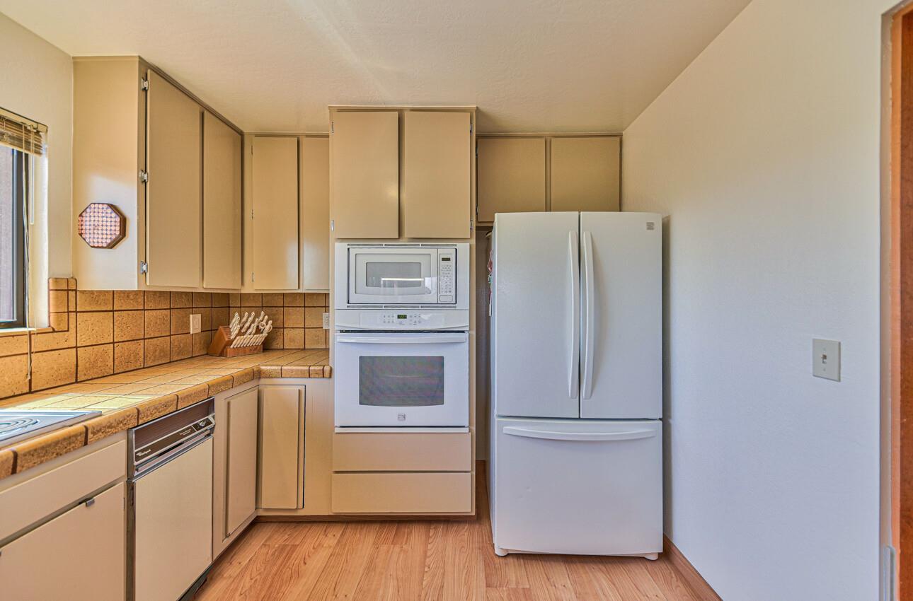 14036 Reservation Road Salinas, CA 93908 - Photo 31 of 50 a kitchen with a refrigerator and a stove