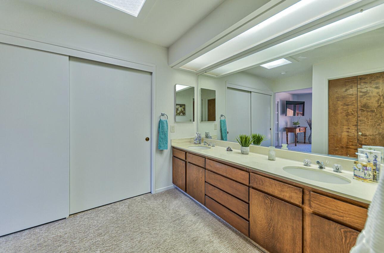 14036 Reservation Road Salinas, CA 93908 - Photo 38 of 50 a bathroom with a granite countertop sink mirror and double