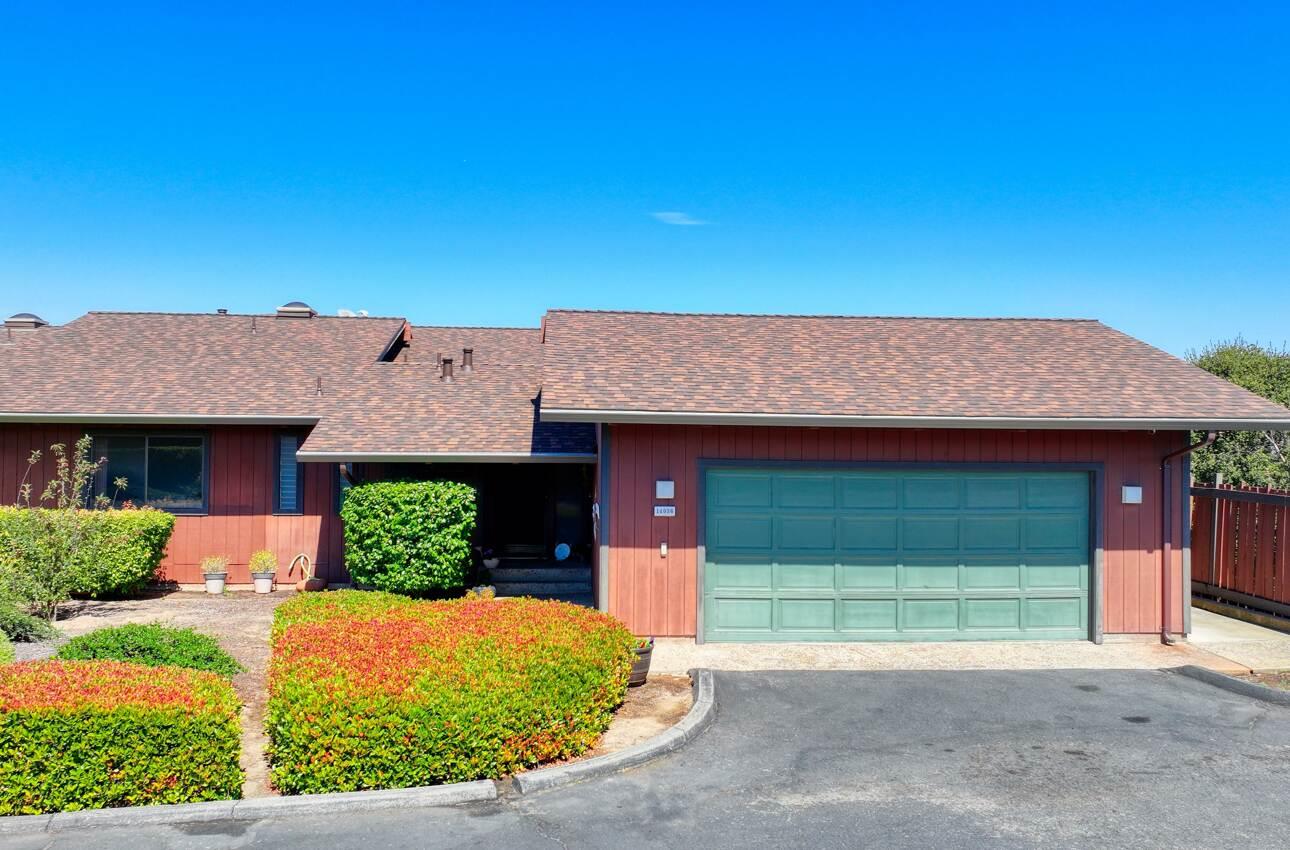 14036 Reservation Road Salinas, CA 93908 - Photo 4 of 50 a front view of a house with a yard and garage
