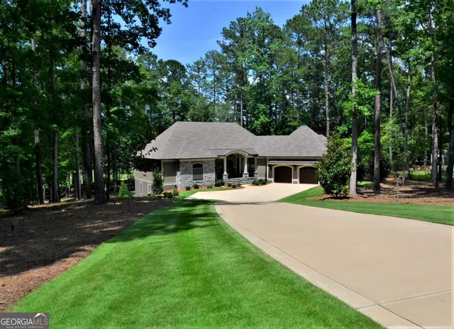 a front view of a house with yard porch and green space