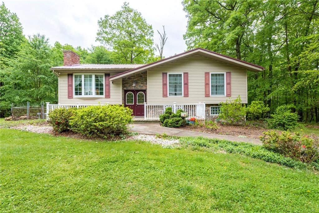238 Greenbrier Road Acme, PA 15610 - Photo 1 of 15 a view of a house with backyard and garden