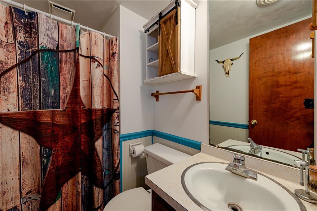 238 Greenbrier Road Acme, PA 15610 - Photo 14 of 15 a bathroom with a sink a toilet and shower