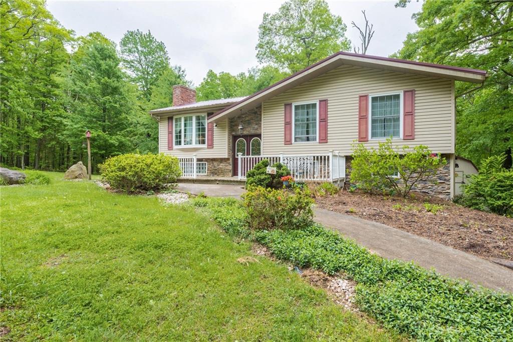 238 Greenbrier Road Acme, PA 15610 - Photo 15 of 15 a front view of a house with a yard