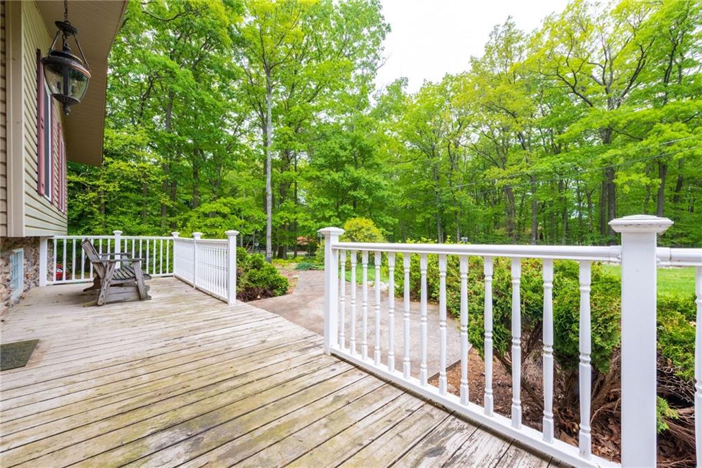 238 Greenbrier Road Acme, PA 15610 - Photo 3 of 15 a view of a deck with two chair and wooden floor